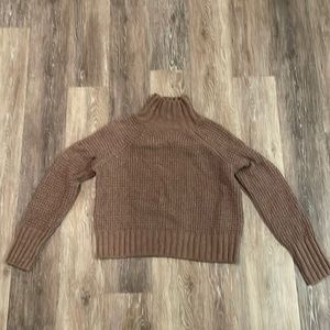 Super soft, mocha, cable knit waist length sweater.